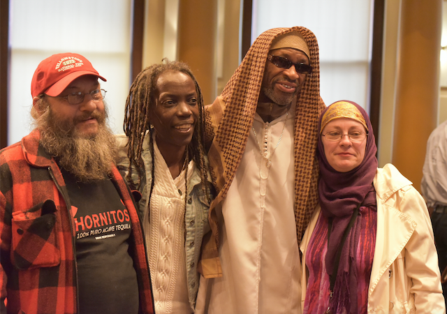 Brad Gibson, JoAnn Hardesty, Ibrahim Mubarak, and Lisa Fay after the resolution passed. Photo by Pete Shaw.